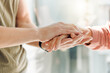 © peopleimages.com - Home, couple and holding hands for support, compassion and empathy with grief, loss and sad. Apartment, closeup and man with woman, help and love with trust, sympathy and mental health with diagnosis