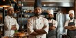 © movinglines.studio - Confident Indian Chefs Standing Together in Professional Kitchen Setting