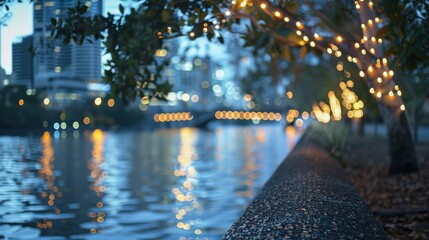 Poster - A view of a city skyline at dusk, with lights reflecting on the water. A tree with string lights hangs over the scene.
