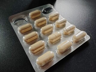 Poster - tablets in a wrapper.