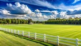 Serene summer afternoon on a lush green polo field with manicured grass, white fences, and goals standing upright, awaiting the next thrilling match.