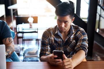 Poster - Asian man, phone and office for reading news, online communication and networking journalist. Male person, notification and app for client chat or website for information, article planning and typing