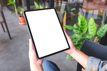 Wall Mural - Mockup image of a woman holding digital tablet with blank white desktop screen