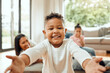 © KayJoint/peopleimages.com - Portrait, family and son with hug, pov and happiness in house, cheerful and relax with smile. Face, people and mother with children, kids and embrace with affection, care and kindness in living room