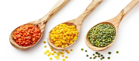 Poster - Yellow red and green lentils in a wooden spoon isolated on a white background providing copy space for your text Top view