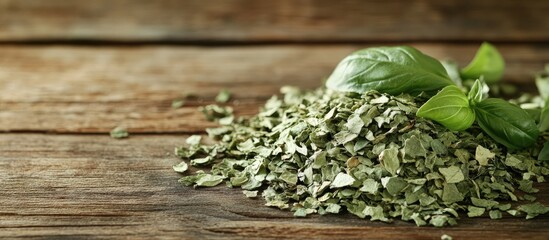 Poster - Heap of Dried Basil Flakes on a Rustic Wooden Background with Copy Space