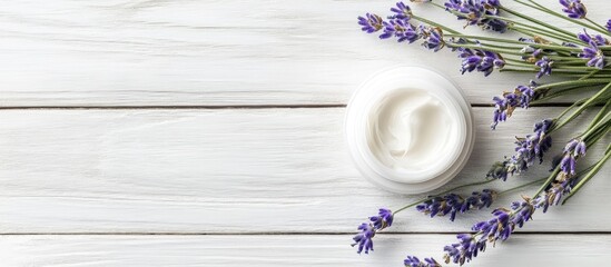 Poster - cosmetic cream and lavender on a white wooden table background. with copy space image. Place for adding text or design