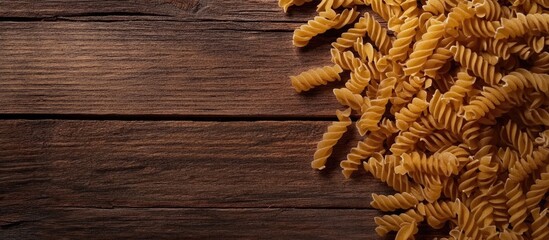 Poster - Dry pasta Viewed from above On a wooden surface Free copyspace