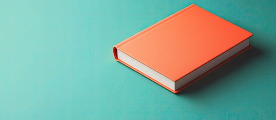Poster - Mockup of the orange hardcover book or notebook featuring copyspace on the table