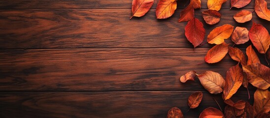 Fototapete - Autumn leaves on a wooden board background with copy space