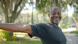 ©  Mohammad Xte - Senior Fitness: Exercise and Black Man Stretching Outdoors at Park - Active Aging, Outdoor Workout, Healthy Lifestyle, Stretching Routine, Senior Health, Park Exercise