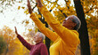 © Luluraschi - elderly people doing light outdoor exercises in an autumn park