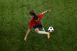 © Lustre Art Group  - Top view image of young sporty woman, soccer athlete doing exercises for balance and attentiveness on green lush stadium. Concept of women and sport, team games, movement, victory, action. Ad