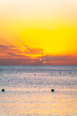 Beautiful yellow and orange sunrise over the sea.