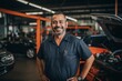 © CojanAI - Smiling portrait of a middle aged car mechanic in workshop