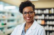 © NikoG - Smiling portrait of a middle aged female pharmacist in pharmacy