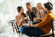 © Geber86 - Diverse young friends drinking coffee in busy cafe