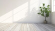 © Vitor - Uma sala branca vazia com piso de madeira e uma planta em vaso