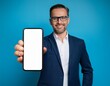 © SandraSevJarocka - Satisfied confident smiling adult businessman showing mobile phone blank white screen mockup