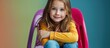 © vxnaghiyev - Portrait of a cheerful girl with a wide smile She is seated on a chair with her legs crossed dressed in bright children s clothing suitable for a girl around ten years old High quality photo