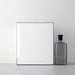 © Chotijah - Minimalist Composition with Blank Canvas and Glass Bottle.