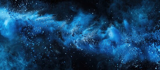 Leinwandbilder - Abstract blue powder splattered background capturing the freeze motion of color powder exploding being thrown with a color glitter texture on a black background. with copy space image
