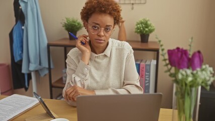 Sticker - At home, cool and confident african american woman with perfect smile sitting at table, radiating joy