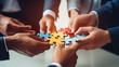 © kinara art design - A group of hands assembling colorful puzzle pieces, symbolizing teamwork and collaboration.