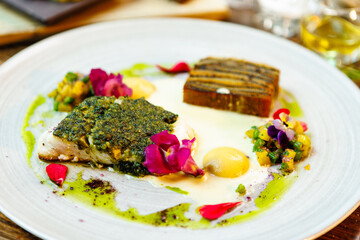 Wall Mural - Pike-perch fillet. Potato gratin, warm yellow beet-turkey bean salad, parmesan dressing. Delicious seafood fish closeup served on a table for lunch in modern cuisine gourmet restaurant