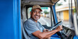 © AMA STUDIO - Happy latin american truck driver smiling while driving looking at camera