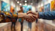 © LuvTK - A detailed photo of a handshake between an artist and a visitor at a lively art gallery exhibit opening, with people and artworks in the background. The handshake is warm,