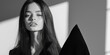 © Maksym - A minimalist fashion shoot with a model wearing sleek, monochromatic clothing