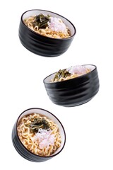 Ramen noodles with seaweed and radish in a bowl on a white isolated background