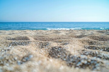 Poster - A serene beach scene with the ocean stretching out into the distance, perfect for travel or nature-themed projects