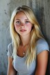 © BrandwayArt - Blonde college student posing in a casual grey shirt indoors