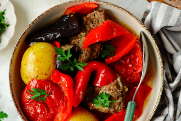 Canvas Print - Cutlets with vegetables in a cauldron in Azerbaijani style.