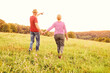© Lumos sp - woman man outdoor senior couple happy lifestyle retirement together smiling love old nature mature back view walking future hope happy holding hands