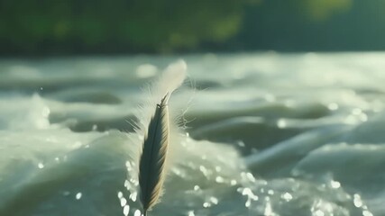 Aufkleber - Closeup of a feather gliding above a river the rushing water creating a hypnotizing backdrop for its peaceful journey.