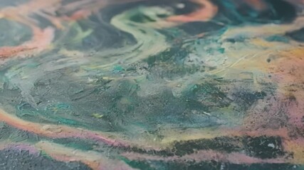 Poster - Slow pan across a chalkcovered table capturing the colorful and textured patterns created by different layers of chalk dust.
