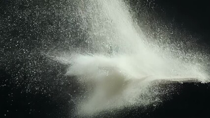 Aufkleber - Extreme closeup of a piece of white chalk being broken and crumbling into a fine chalk dust.