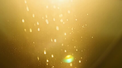 Aufkleber - A closeup of a sunbeam filtering through a window illuminating the dust particles suspended in the air before they finally land on a nearby chair.