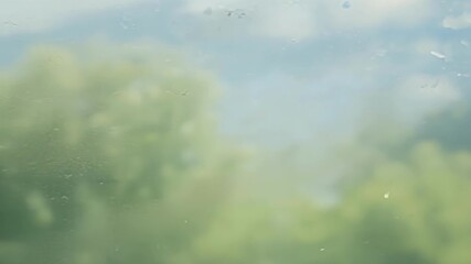 Leinwandbilder - A series of closeup shots showcasing the gradual buildup of dust on a window as time passes by creating a layered and textured effect.