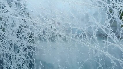 Aufkleber - The camera slowly moves along a frosted window highlighting the intricate details of a weblike frost pattern with sparkling crystals and delicate lines.