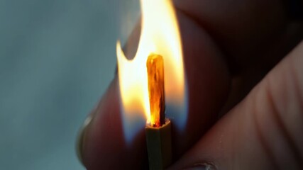 Poster - Despite its small size the flame of the match is powerful and captivating as it radiates light and warmth in the palm of a hand.