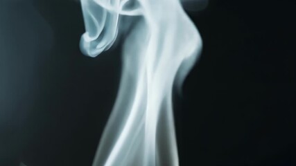 Aufkleber - The delicate tendrils of smoke from a recently extinguished candle delicately move in the air forming elegant shapes.