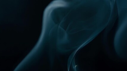 Aufkleber - Wispy smoke rings slowly expanding and contracting creating a mesmerizing pattern against a dark background.