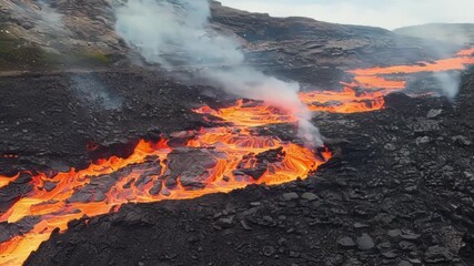 Poster - A mesmerizing closeup of lava slowly crawling over a rocky terrain leaving a trail of scorch marks behind.