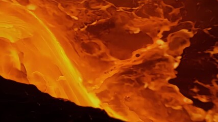 Aufkleber - The camera zooms in on the mesmerizing shapes and textures of a lava flow with molten lava continuously oozing and morphing to create unique and everchanging patterns.