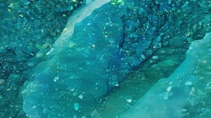 Aufkleber - The camera slowly moves over a large mineral deposit showing the gradual change in color and texture from one end to the other.