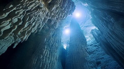 Poster - A breathtaking view of a massive chamber in the cave filled with countless stalactites and stalagmites of various sizes creating a grand and aweinspiring sight.